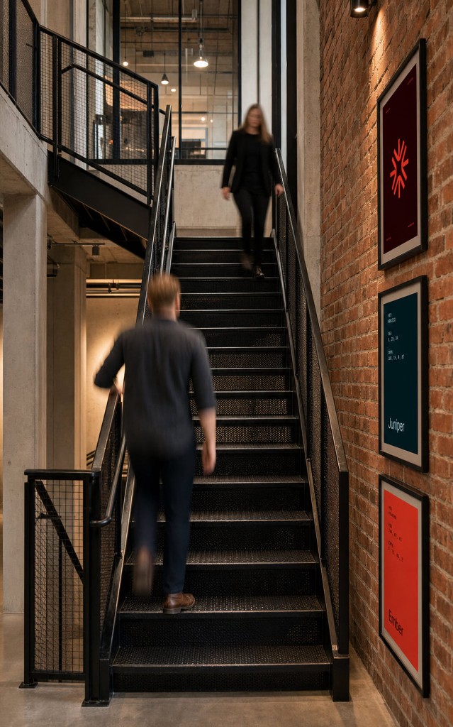 Magnet studio interior with industrial staircase and brand artwork